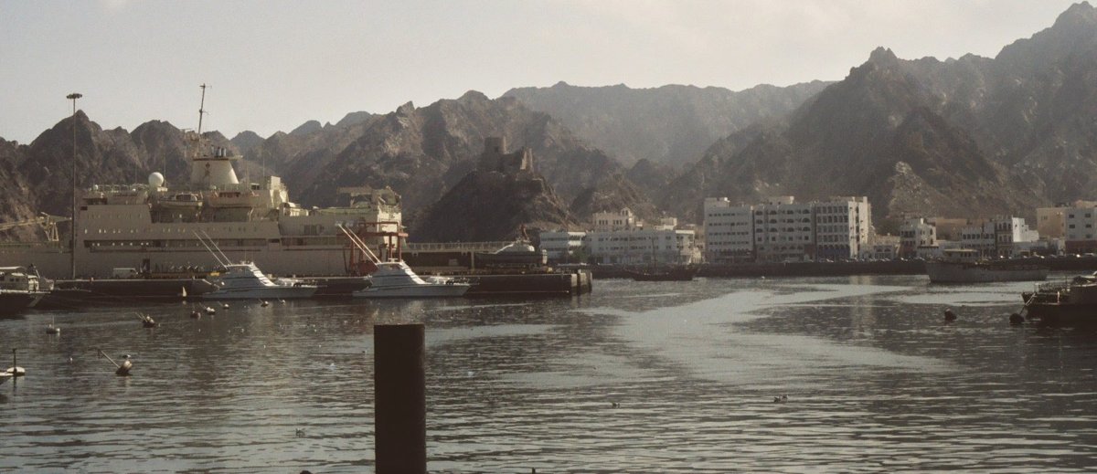 Cropped real photograph of vessels moored in Muttrah harbour in Muscat, Oman